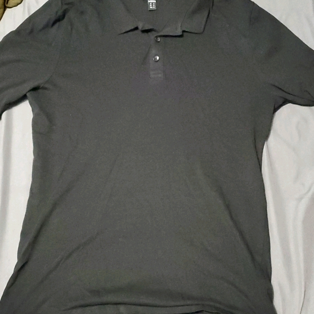 A black muscle fit polo